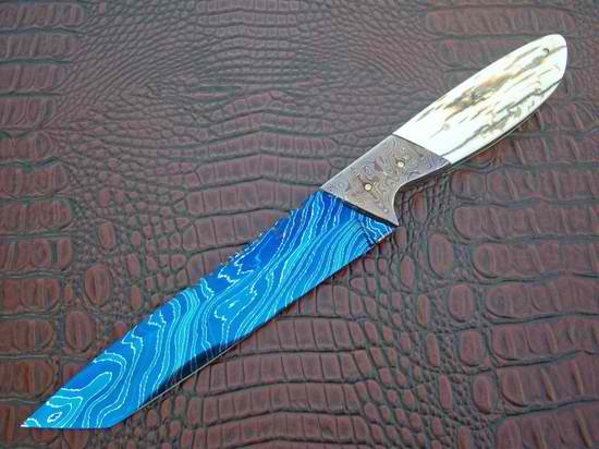 by Phil Ernest in blued damascus and mammoth ivory