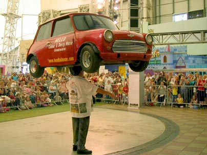 John Evan managed to balance a 352-pound mini car on top of his head for 33 seconds without using his hands.