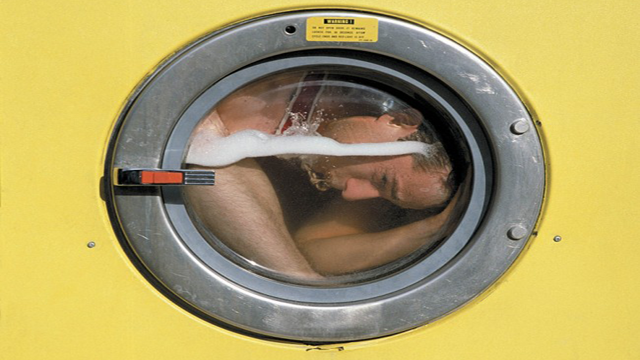 Getting out of six pairs of handcuffs and two leg irons escape artist Rick Meisel took a few tumbles and nearly drowned before escaping this spinning washing machine.