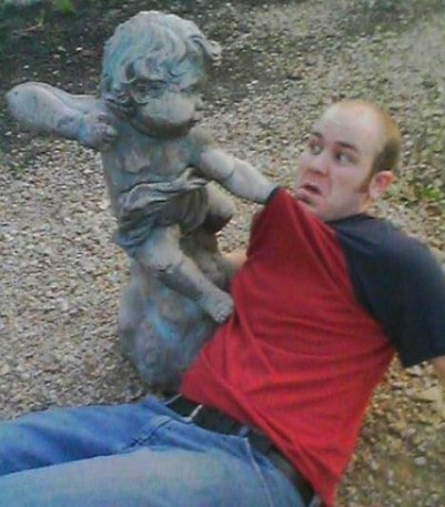 People Messing Around With Statues