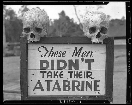 Advertisement for Atabrine, an anti-malaria drug. Sign was put up at the 363rd station hospital in Papua, New Guinea during WWII
