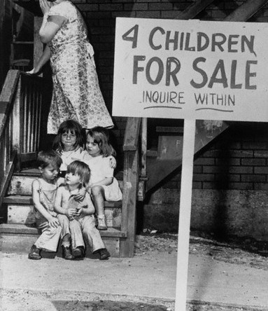 A penniless mother hides her face in shame after putting her children up for sale, Chicago, 1948