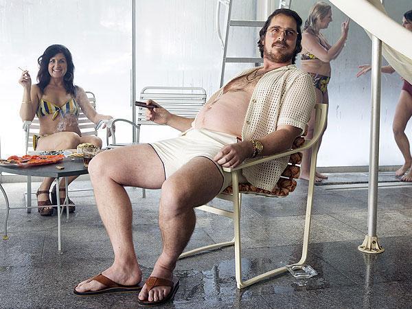 Bale THEN gained 44 pounds (not the muscle weight) eating donuts, cheeseburgers and tons of junk food to bulk up for his role in “American Hustle”

Bale estimated going from about 185 to 228 pounds for “American Hustle.” The actor also shaved his head, and slouched enough to accidentally herniate a disc in his back. The actor was so unrecognizable that actor Robert De Niro had to ask who Bale was upon meeting him on the set.