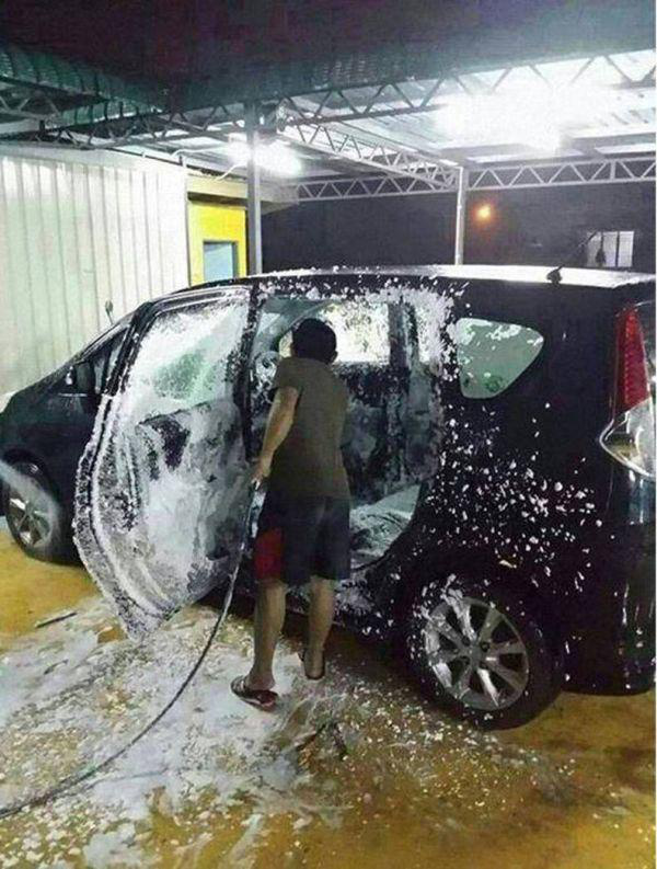 guy washing inside of car - Max Zva