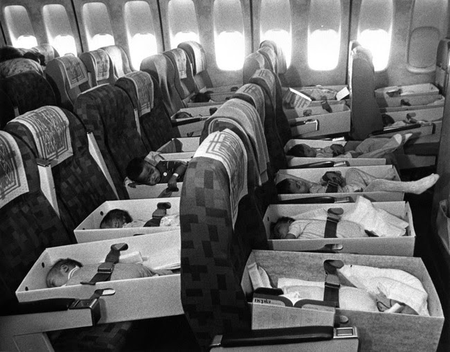 Orphans of the Vietnam War are flown to the USA, during Operation Babylift in 1975.