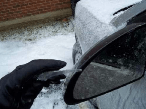 Put plastic bags over your side mirrors

This will keep those tiny mirrors from freezing over.