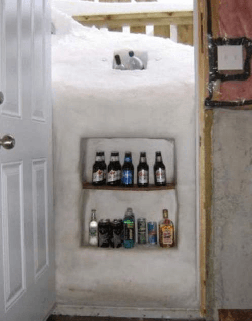 Create your own beverage cooler

If you find yourself snowed in, just use the cold to your own advantage by creating a snow fridge for all your cold beverages.  Anytime someone asks for a drink, just tell them to open the basement door and get their own.