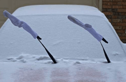 Sock on the windshield

Keep your windshield wipers from getting frozen by covering them with socks.