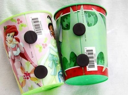 Put magnets on your kid's cups so that they stick to the fridge.