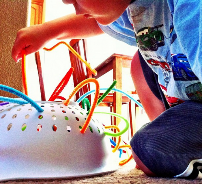 Keep your toddler entertained with little more than a colander and some pipe cleaners.