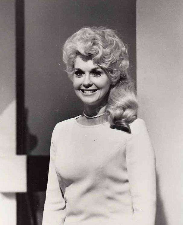 January 1, 2015: Donna Douglas, best known for playing Elly May Clampett on TV series The Beverly Hillbillies, has died of pancreatic cancer. She was 82.

Douglas's niece, Charlene Smith, confirmed that the '60s bombshell passed away at at Baton Rouge General Hospital near her home in Louisiana. Douglas was born Dorothy Smith, and grew up as a tomboy in a small town. She moved to New York and landed small roles in Twilight Zone and Eye of the Beholder, before getting her big break as Elly May. After the incredibly popular series was cancelled, she went on to star with Elvis Presley in 1966's Frankie and Johnny. Douglas is survived by her son, Danny Bourgeois.