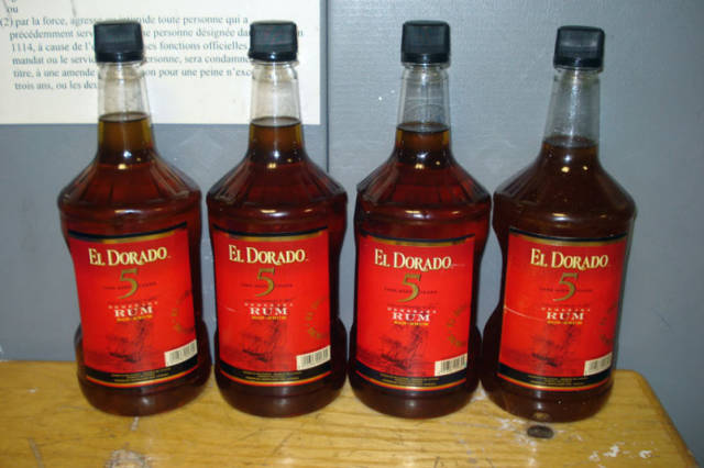 Rum bottles filled with liquid cocaine in New York. A man arriving from Guyana at Kennedy International Airport in New York was found to be carrying the bottles that customs officials said were filled with 18 pounds worth of liquid cocaine. The drugs had a street value of $310,000. (£203,000)