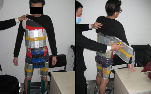 Customs officials at Futian Port in China were suspicious of a man's 'weird posture'. They made a startling discovery when they searched him as he attempted to leave leave Hong Kong: a suit of armour made of 94 iPhones and several rolls of cling film.