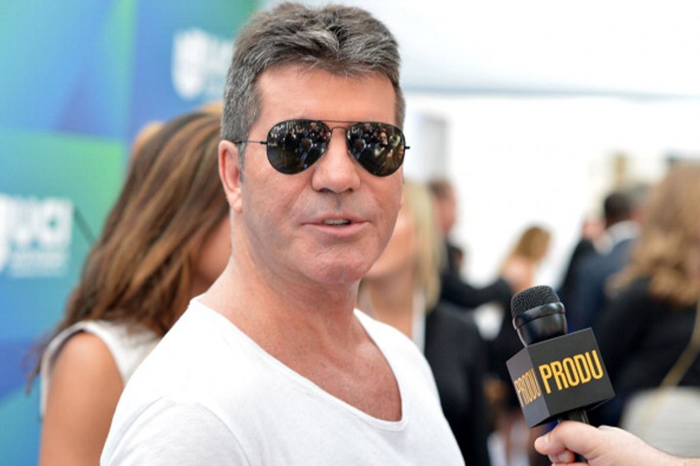 Simon Cowell performs some serious tree climbing each and every day.