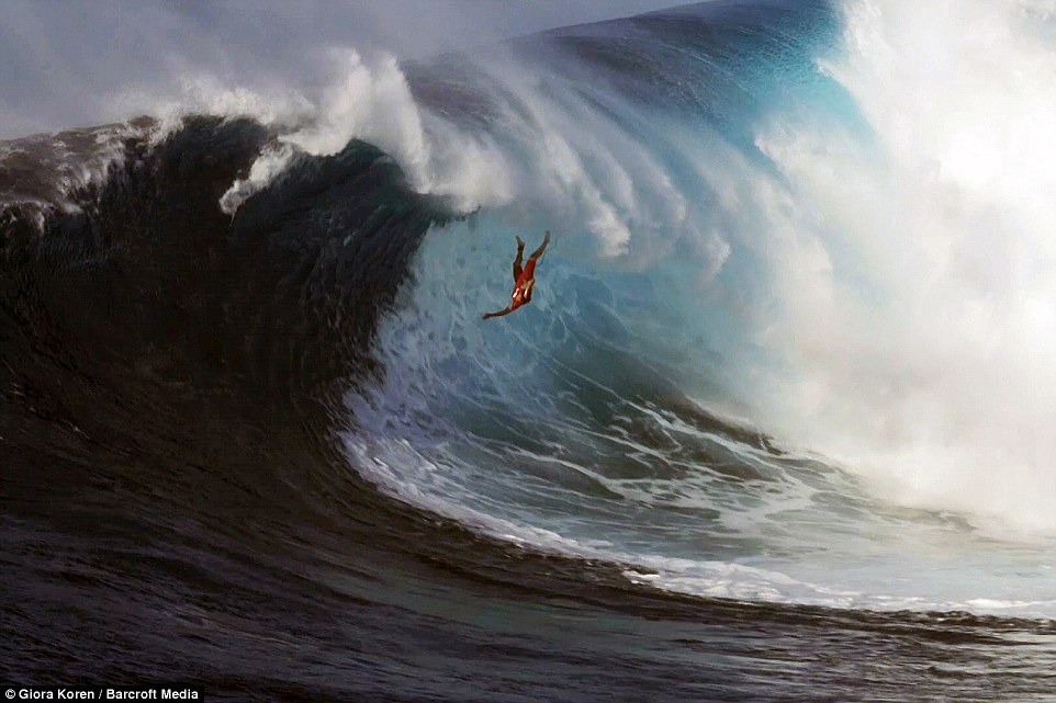 A surfer wipes out on a 12 metre-high wave in Maul, Hawaii:
