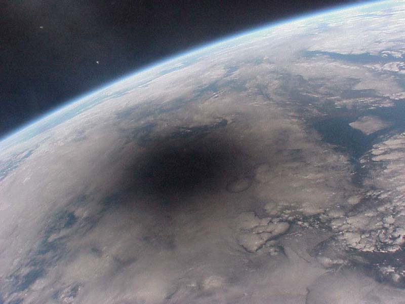 An Eclipse on Earth seen from space...that looks like the spread of the zombie apocalypse.