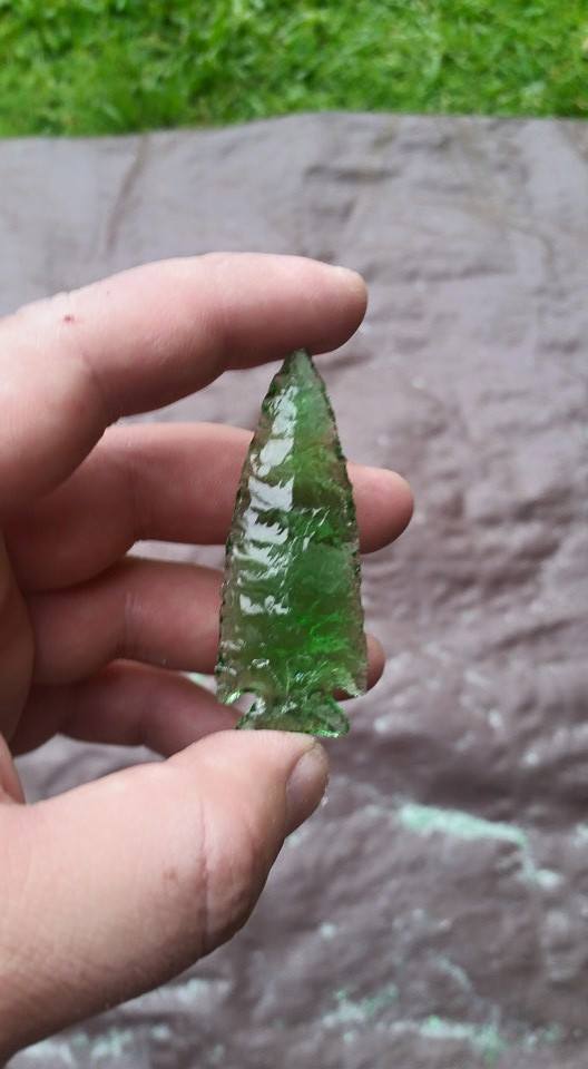 An arrowhead made from the bottom of a 7UP bottle.
