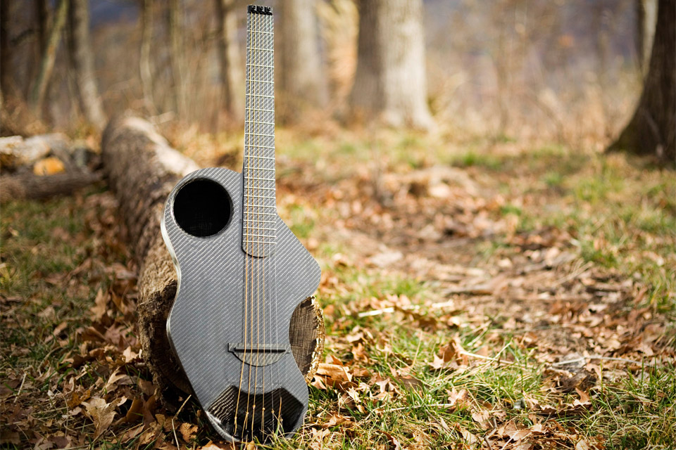 Alpaca Travel Guitar - Carbon fiber, flax fabric, and bio-derived resins, this waterproof instrument features a headless neck, a soundhole near the forward part of the body, an embedded daisy chain on the back for connecting it directly to any outdoor gear.