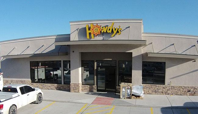 Howdy's convenience store with their iconic yellow sign