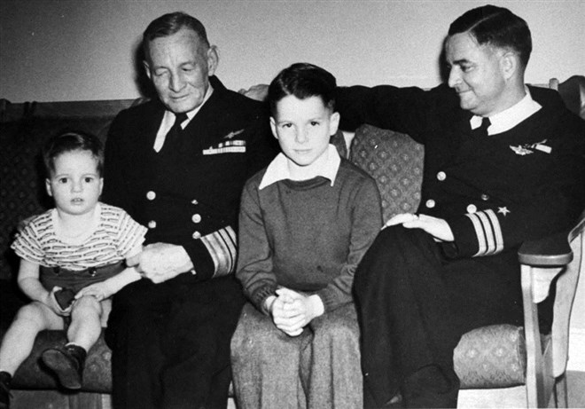 John S. McCain III, center, with his grandfather Vice Admiral John S. McCain Sr., at left, and father Admiral John S. McCain Jr. in a family photo from the 1940s.