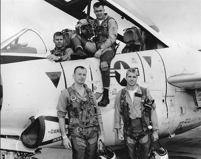 McCain, front right, with his squadron in 1965. A Navy fighter pilot, McCain served in Vietnam and was awarded the Silver Star, Bronze Star, Legion of Merit, Purple Heart, Distinguished Flying Cross Medal, and Prisoner of War Medal.