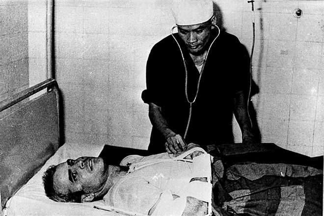 A Vietnamese doctor examines McCain after he was captured in 1967. He suffered injuries in the crash when his plane was shot down and was subsequently tortured as a POW during his five years of imprisonment in Hanoi.
