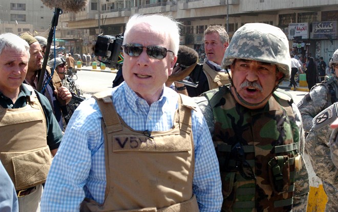 McCain visits the popular Shorja market in central Baghdad on April 1, 2007. McCain charged that the American people were not getting a "full picture" of progress in the security crackdown in the capital. McCain voted for the Iraq War Resolution in 2002, and began questioning troop levels as early as 2003.