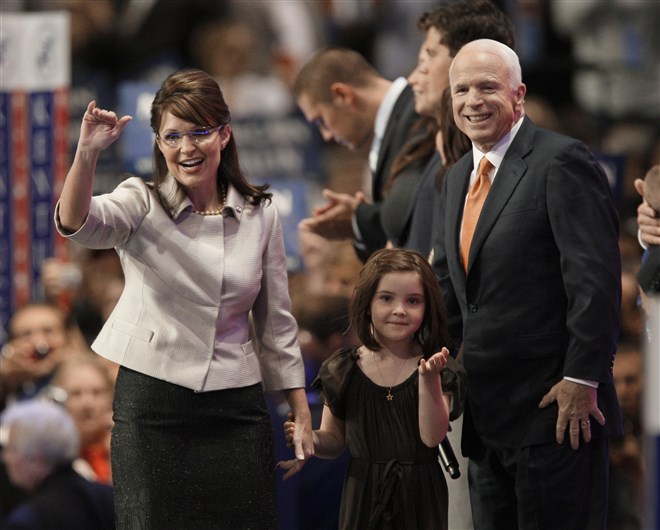 McCain joins his running mate Alaska Gov. Sarah Palin and her daughter Piper at the end of her speech at the Republican National Convention in St. Paul, Minnesota on Sept. 3, 2008.
