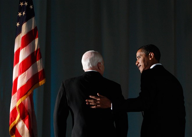 President-elect Barack Obama speaks with McCain at a bipartisan dinner honoring McCain in Washington on Jan. 19, 2009.