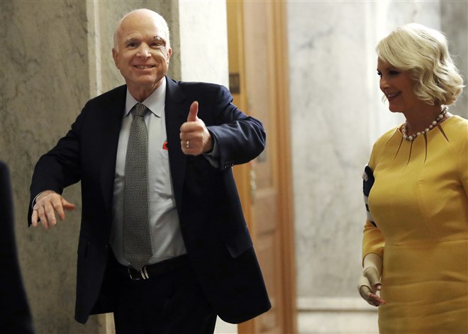 McCain returns to the Senate with his wife Cindy on July 25, 2017.  McCain had been recently diagnosed with brain cancer but returned on the day the Senate was holding a key procedural vote on President Donald Trump's effort to repeal and replace the Affordable Care Act. He voted yes on a motion to proceed to debate on Republican health care legislation but a few months later decided to vote against the Republican health care bill.