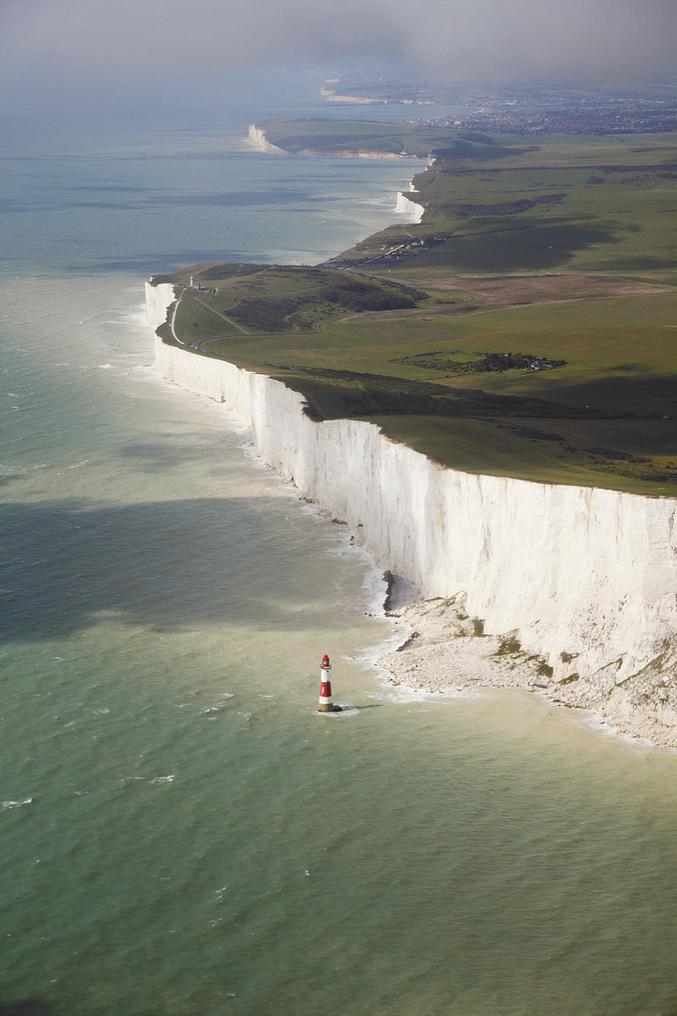 Beachy Head, EnglandWhite cliffs and a little candy striped lighthouse.