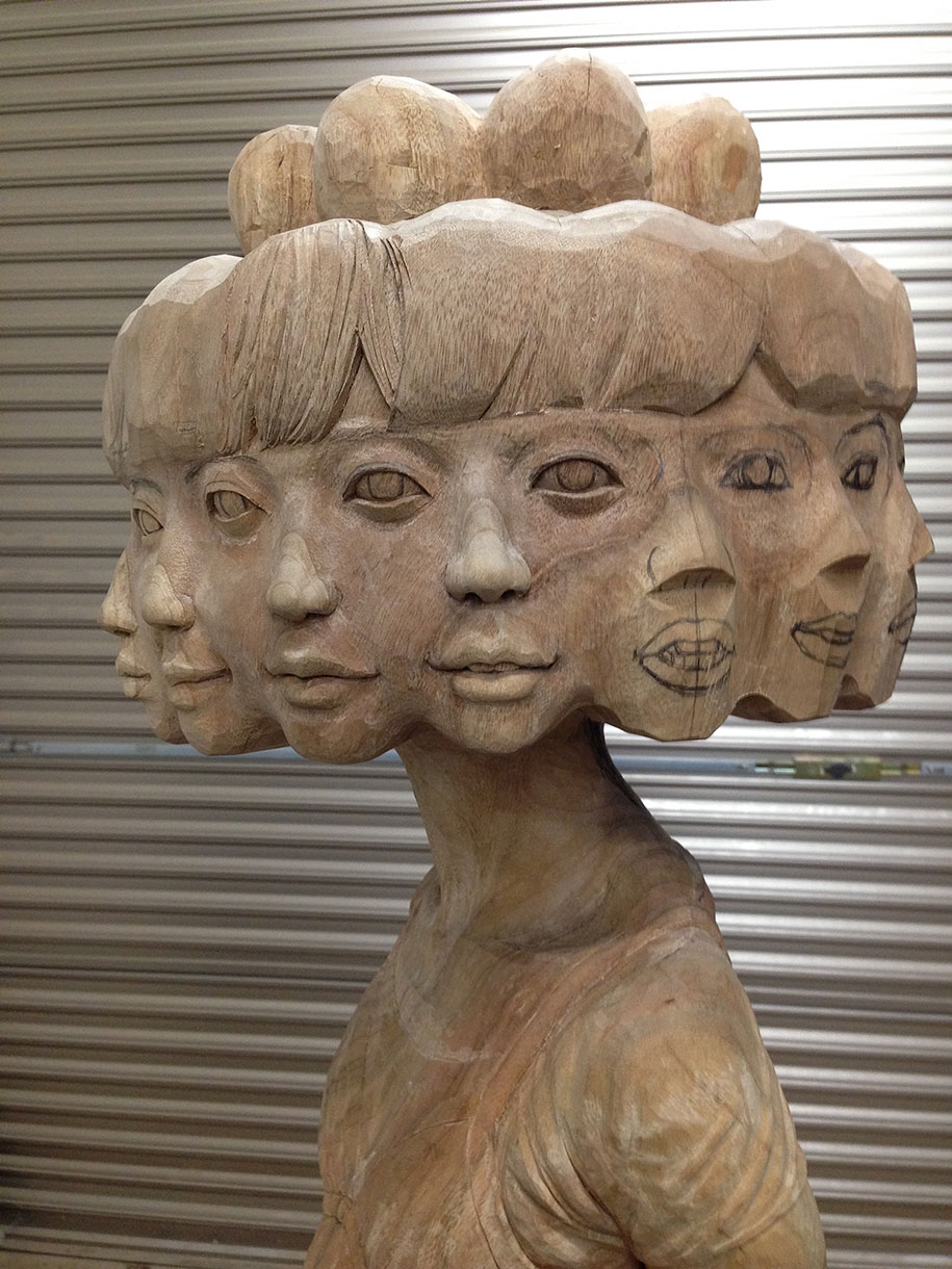 Japanese Artist Turns Wood Into Twelve-Faced Girl