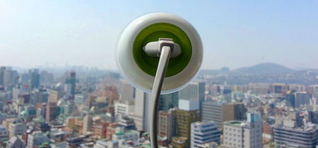 Solar powered outlet sticks to glass