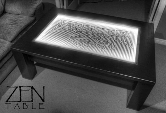 Upload images to the Zen table and watch as they are drawn in the sand beneath the glass