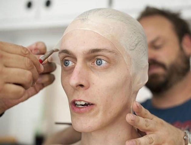 The Walking Dead makeup team fits actor Kevin Galbraith with a bald cap and accentuate his high cheekbones to make them look sunken.