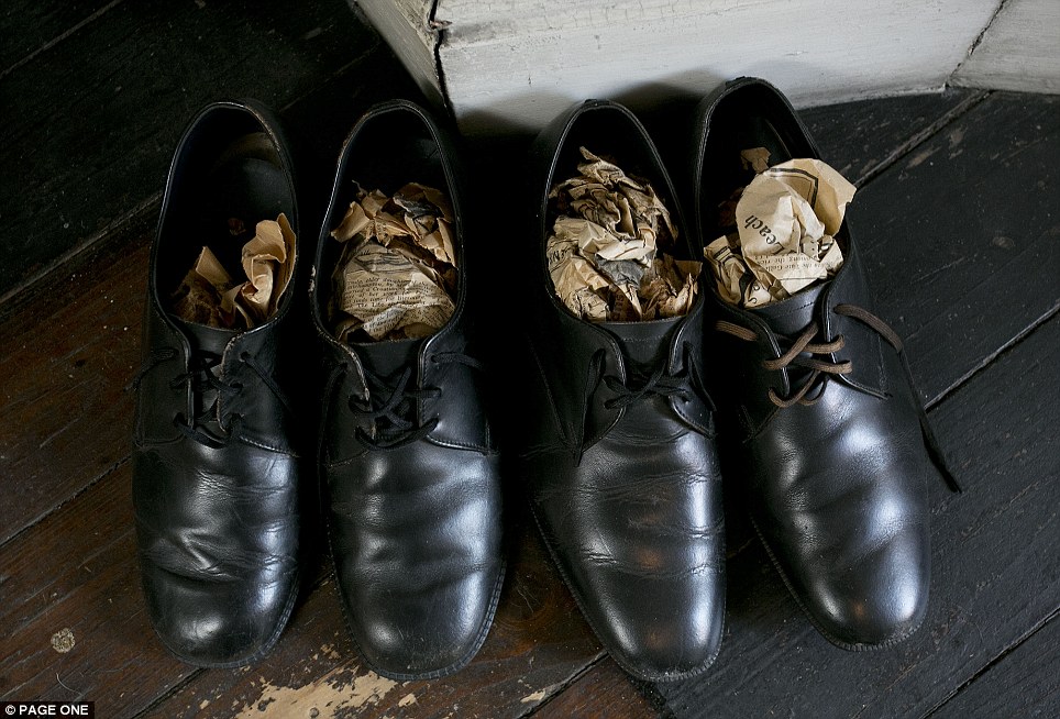 From an age when things were made to last: Beautifully polished, although missing one of the original laces, Mr Straw's black leather shoes are still pristine