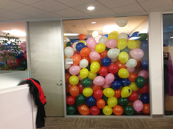 Nothing says "happy birthday" like having to clean up an inordinate amount of balloons during the work day.