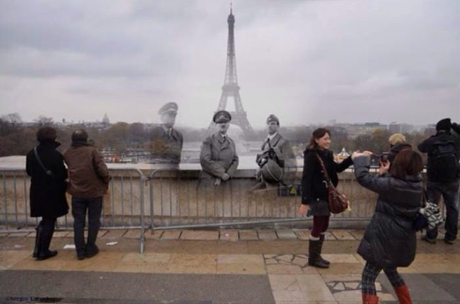 Hitler at the Eiffel Tower.