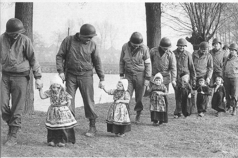 American soldiers take Dutch children to a dance. [World War II, c. 1944 - 1945]