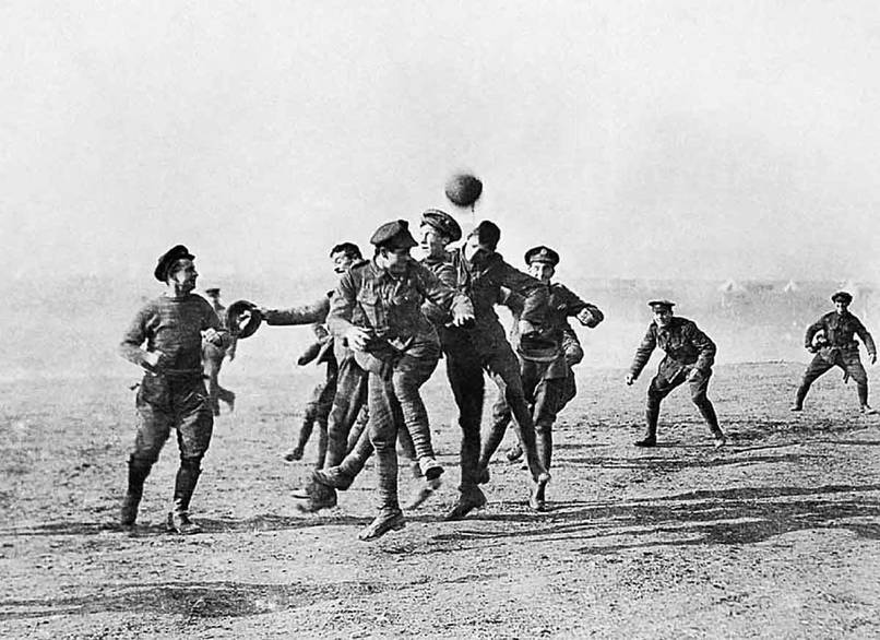 British and German soldiers on the Western Front leave their trenches for a football match. [World War I, 24 December, 1914]