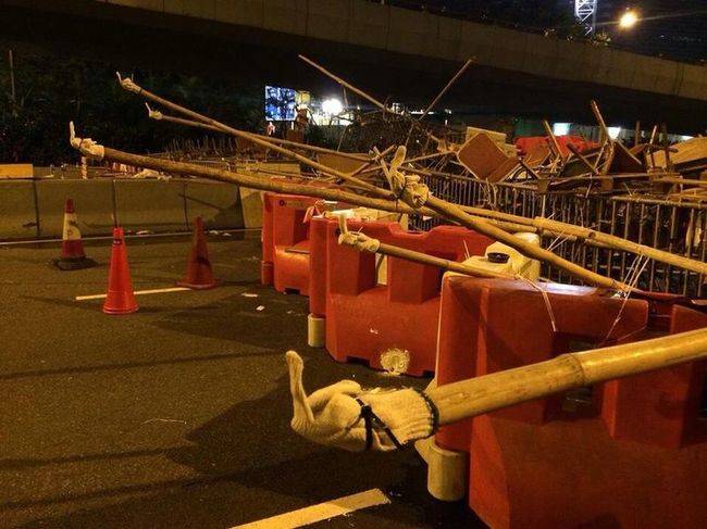Protestors in Honk Kong form a roadblock.