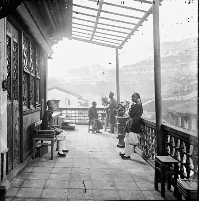 Lounging on the terrance of a Chinese teahouse in Hong Kong.