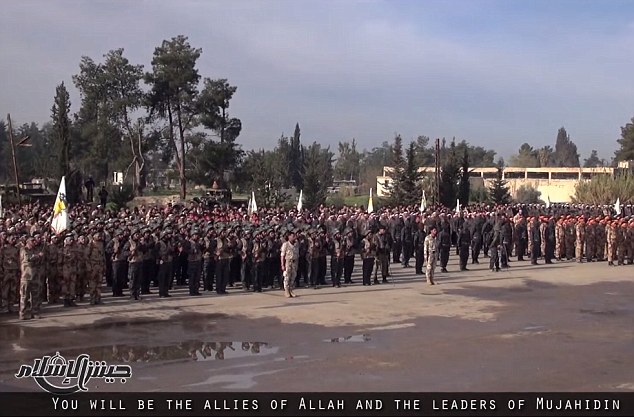 The troops marched in perfect unison as they were watched by the militants’ proud leadership.