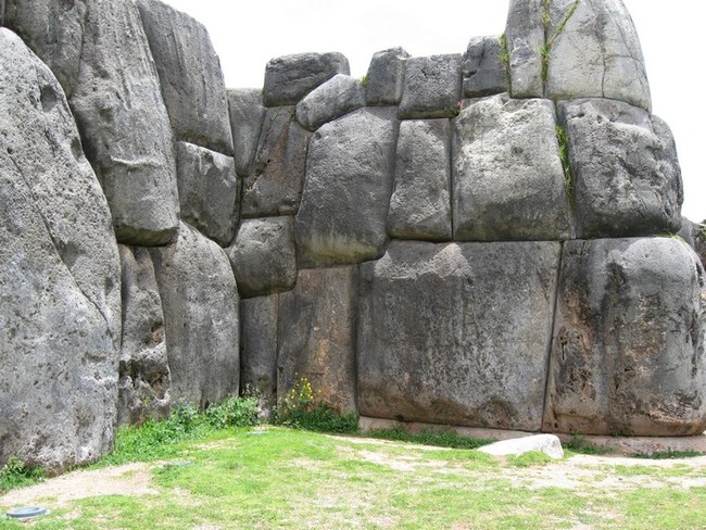 Sacsayhuamán: 
This ancient Peruvian site has confused archaelogists for quite some time, as the giant stones in the wall are so close together that not even blades of grass can slide between them. It has also survived for thousands of years with no visible mortar keeping it together.