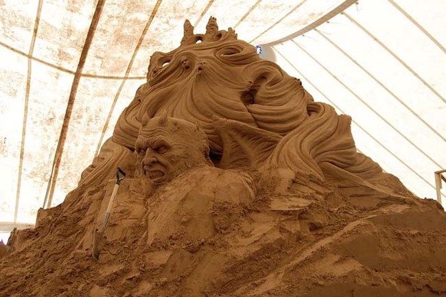 This Man's Disturbing Sand Castle...
