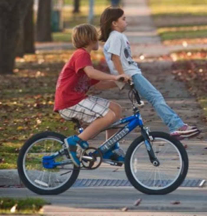 riding on bike pegs