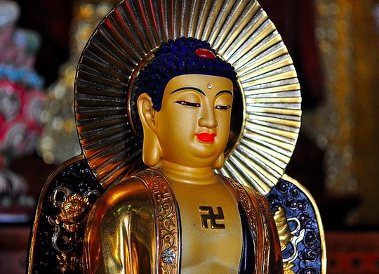 Buddhist Communities: In Buddhism, the swastika is a very important symbol meaning "the resignation of the spirit." It is considered to be the seal of Buddha's heart, and can be seen on his chest in various works of art.
