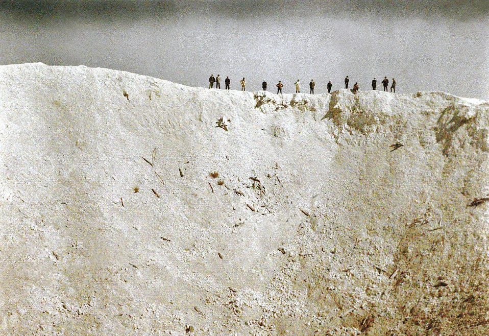 7th June, 1917 – Soldiers stand on the ridge of a 45m deep crater that was created by mines placed by British forces underneath German positions. Around 10,000 soldiers died in the blast near Messiness in West Flanders: