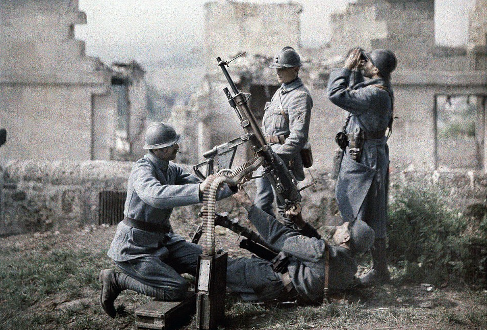In another shot from the Battle of the Aisne, a French section of machine gunners take position in the ruins: