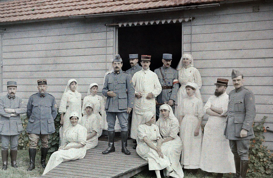 1st, September, 1917 – Uniformed doctors and nurses stand in front of field hospital 55 in Bourbourg, northern France: